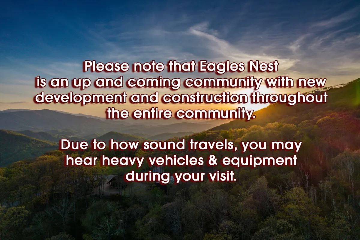 A panoramic view of the surrounding mountain landscape at Eagles Nest, with a dramatic sunset sky and lush forested areas. This view embodies the natural beauty and sense of adventure available through hiking and exploration trails within the community.